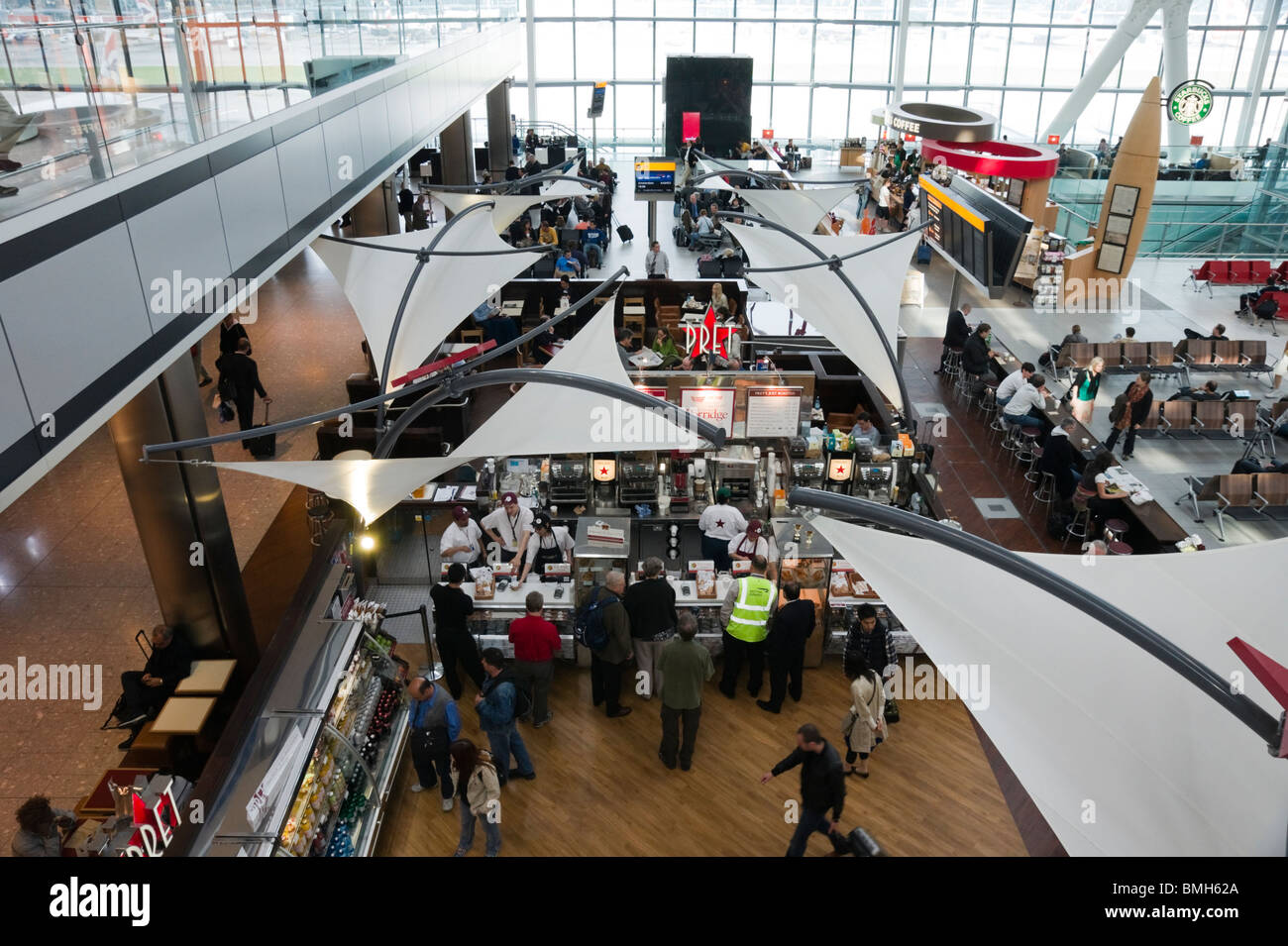 London Heathrow Airport Terminal 5 - restaurant facilities - the food hall area with many cafes and internet facilities Stock Photo