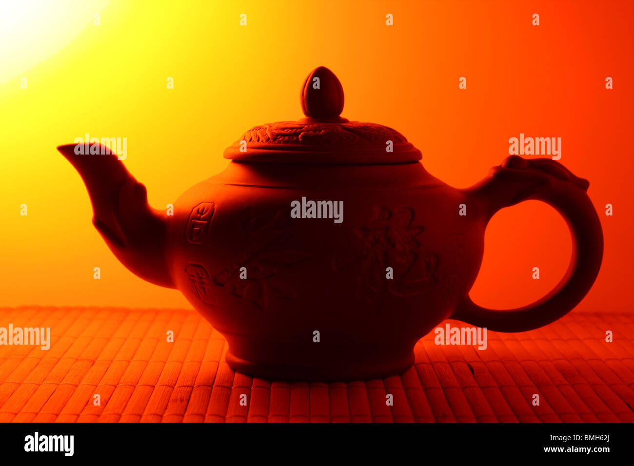 Classic chinese teapot of brown clay on bamboo rug Stock Photo Alamy