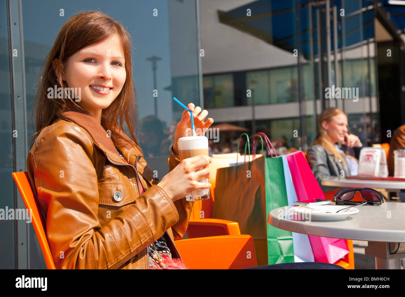 Girl enjoying coffee after shopping Stock Photo