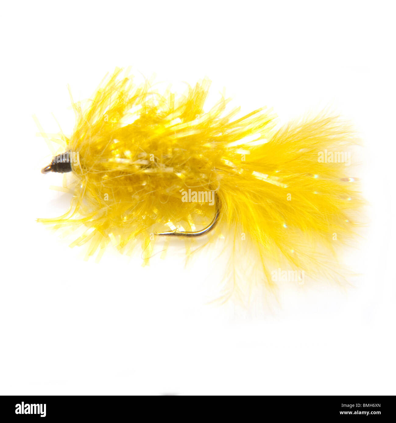 Yellow blob trout fly isolated on a white studio background. Stock Photo