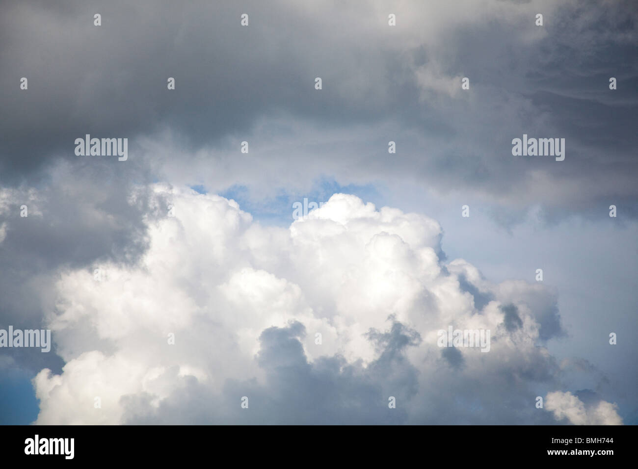 Rain filled clouds against a blue sky background, Hampshire, England. Stock Photo