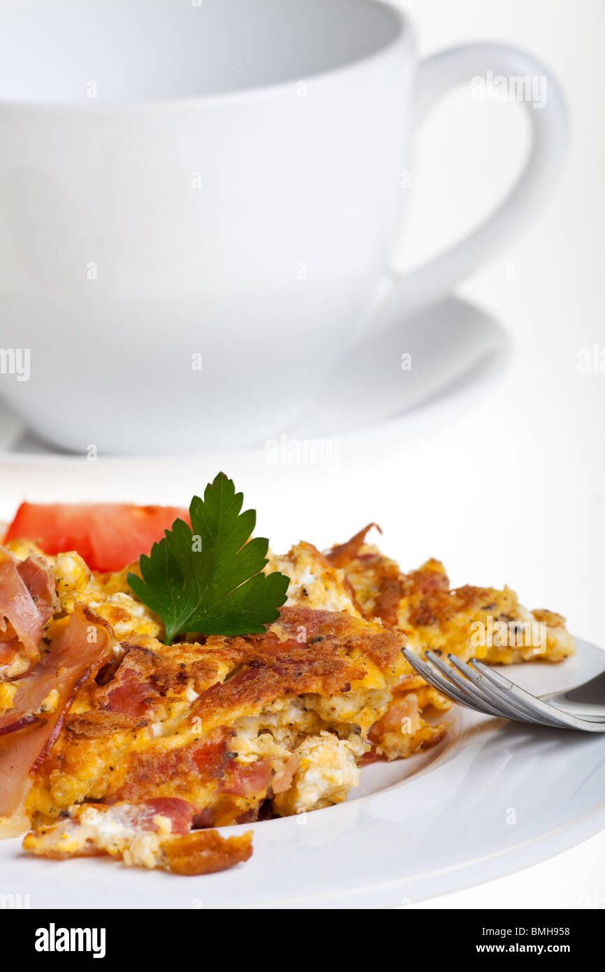 scrambled eggs and bun on a plate isolated on white Stock Photo - Alamy