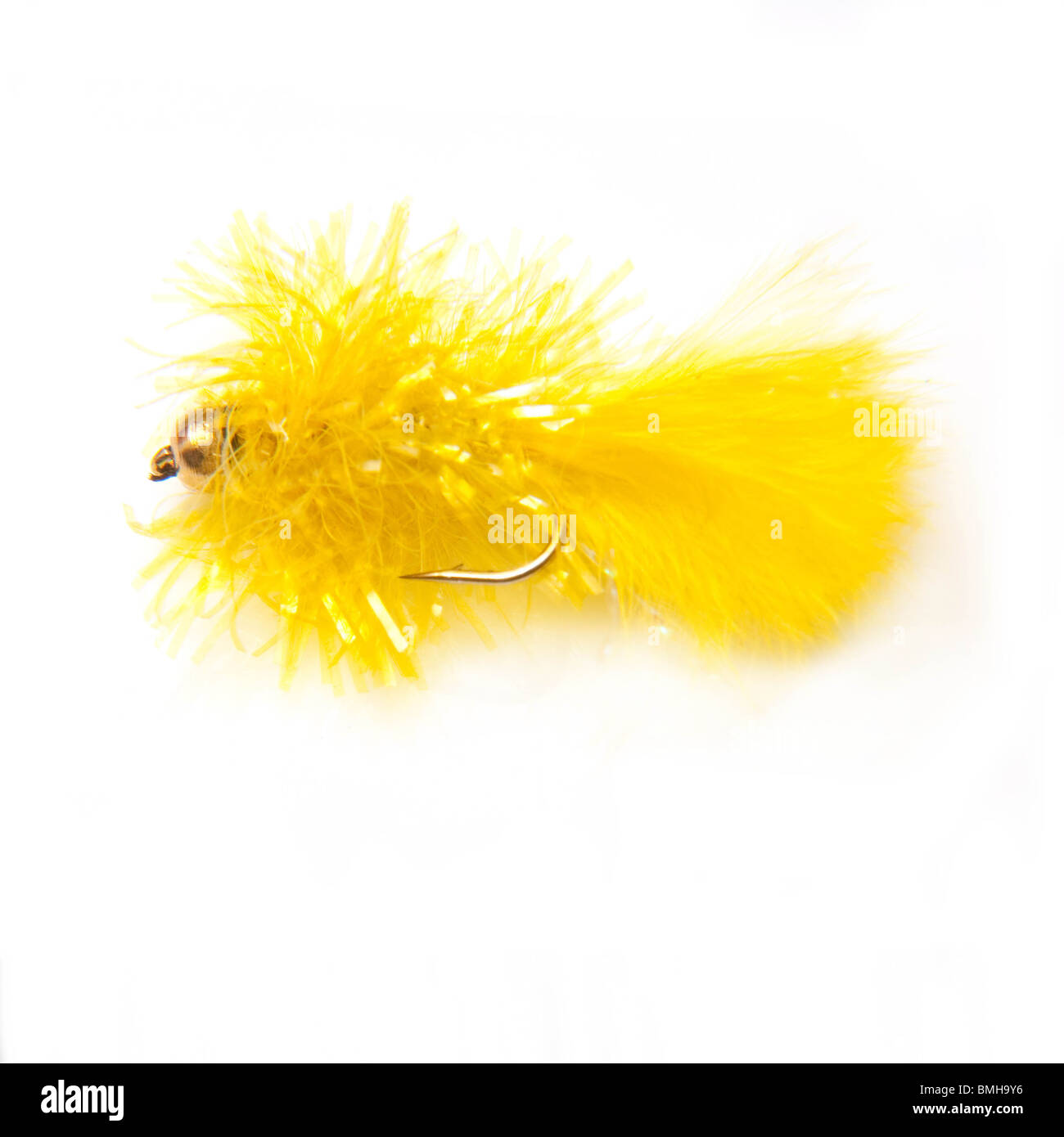 Yellow blob trout fly isolated on a white studio background Stock Photo