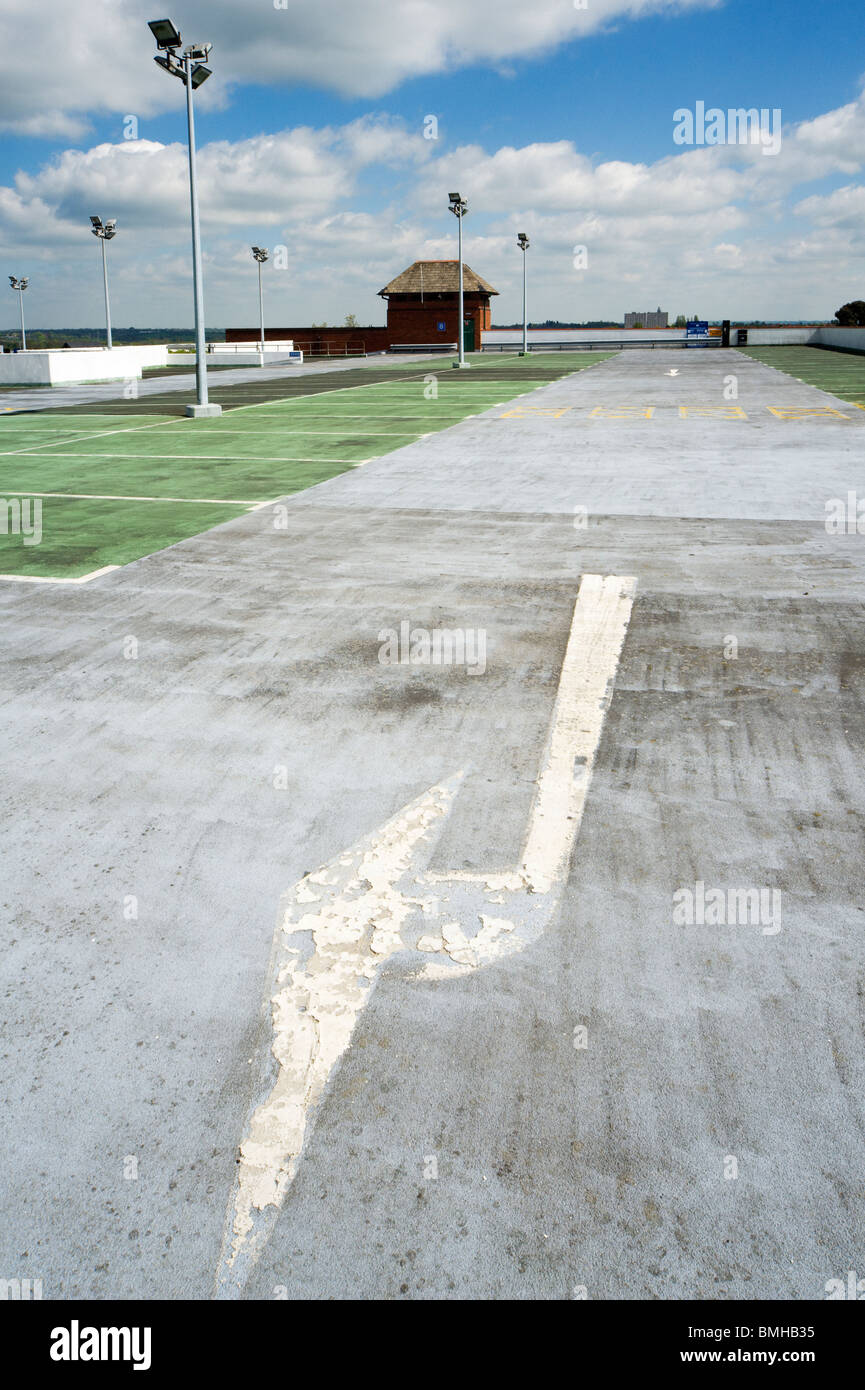 Flow direction arrow on top floor of multi-storey car park, Rugby, West Midlands, UK Stock Photo
