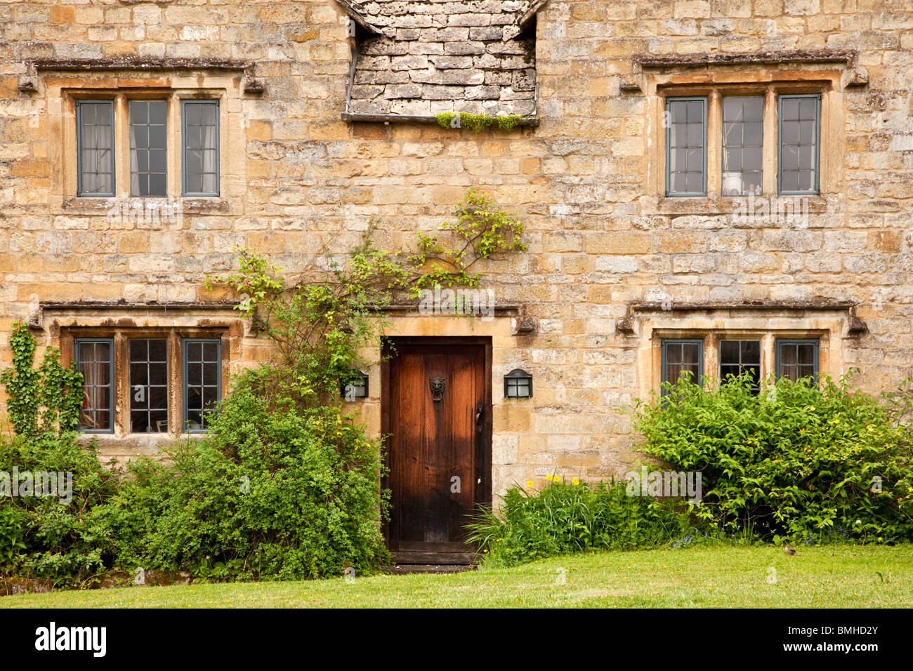 A typical traditional old Cotswold stone village country house with