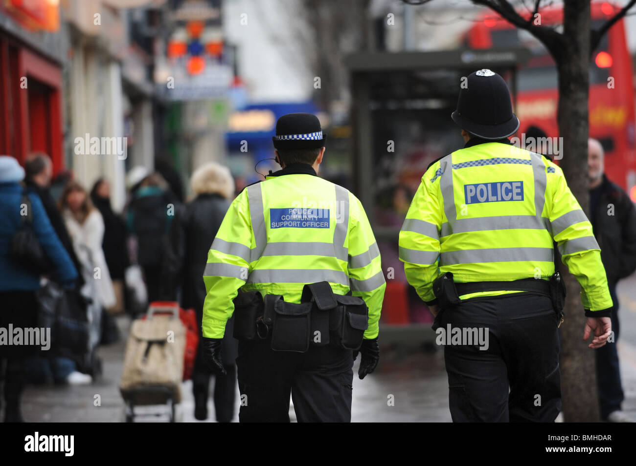 A police officer and a pcso on walk on the beat in Brighton Stock Photo