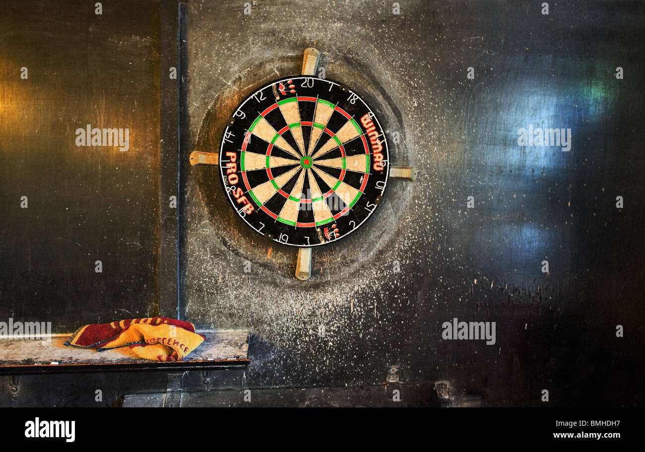 A dartboard on a wall in the Golden Rule Public House, Ambleside, Lake District, UK Stock Photo