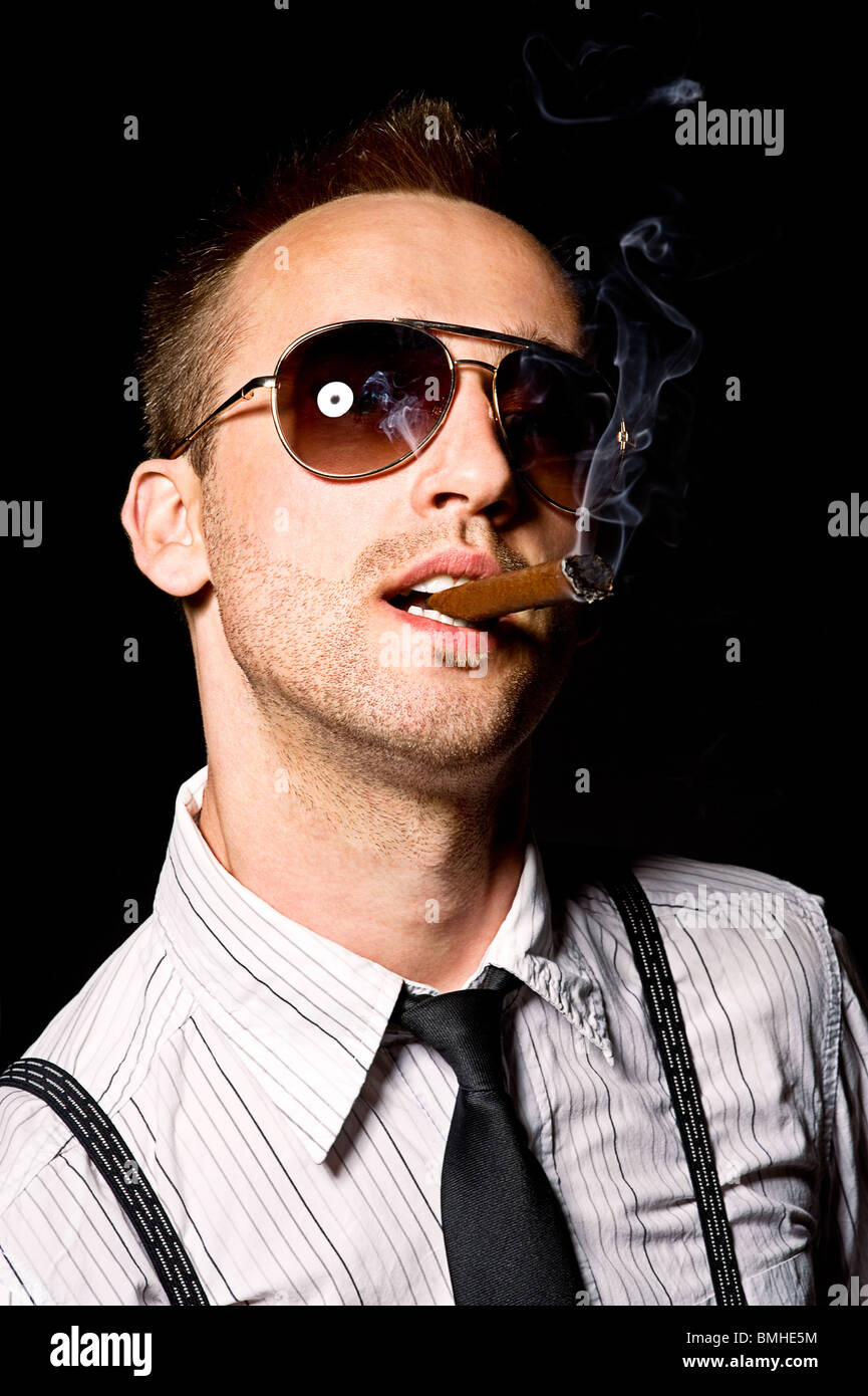 young businessman smoking cigar Stock Photo