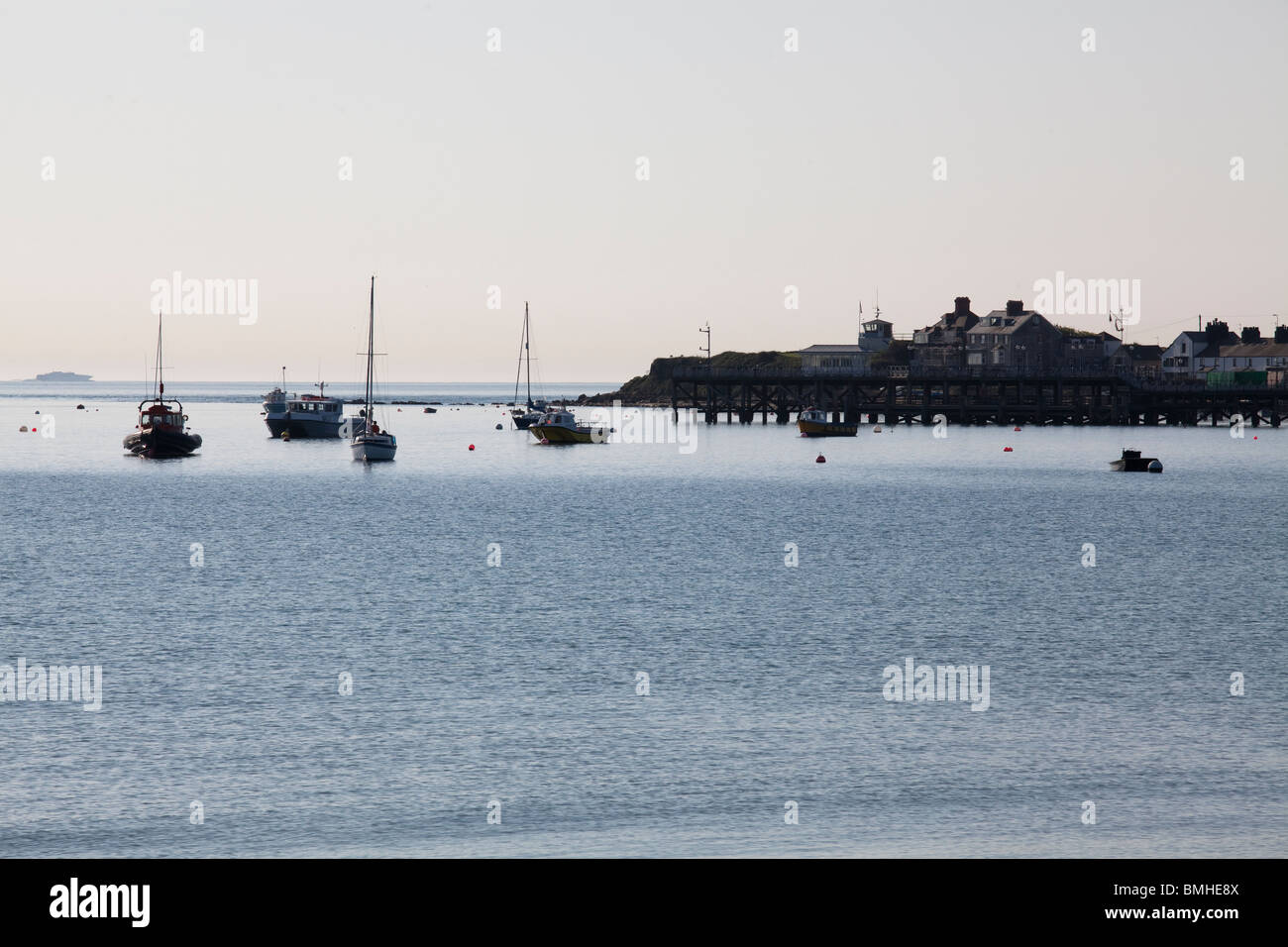 moored boats in Swanage Bay in the early morning light Stock Photo