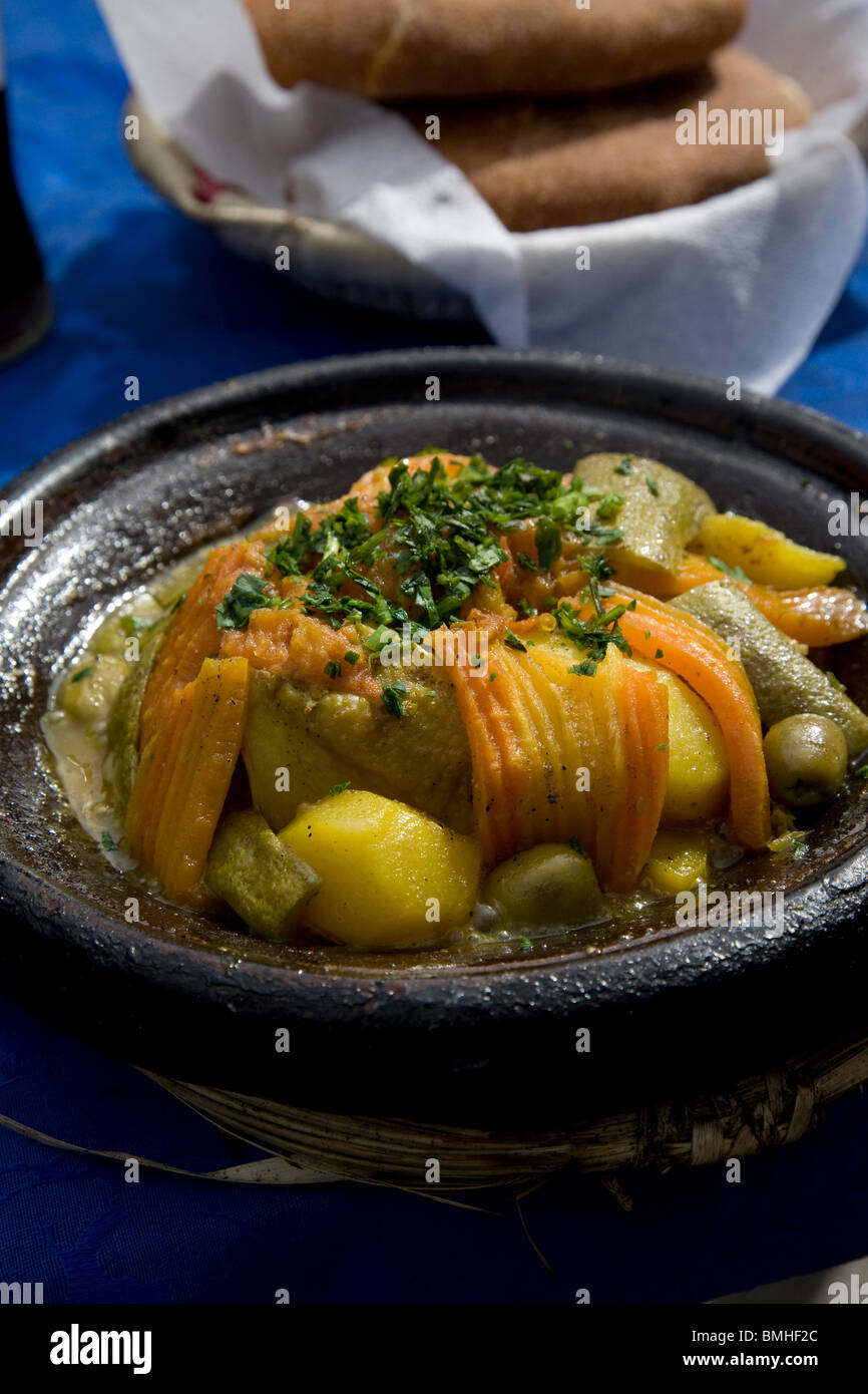 Tajine, or tagine, a type of cookware and traditional dish, that is common with Moroccan cuisine, as seen here in Marrakech. Stock Photo