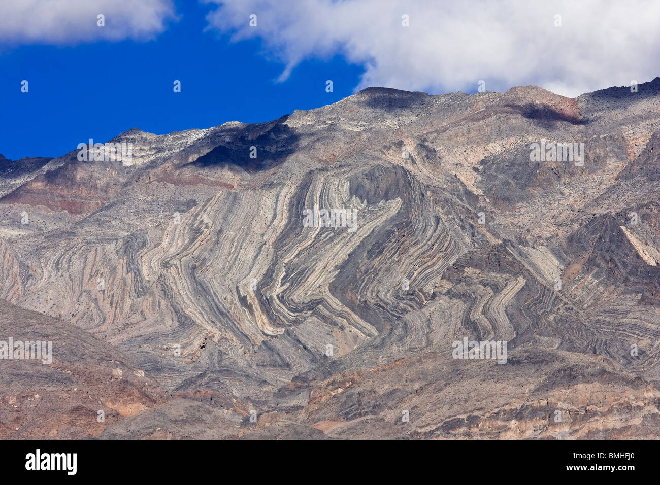 Interesting metamorphic rock patterns in the mountains at Death Valley National Park, California. Stock Photo
