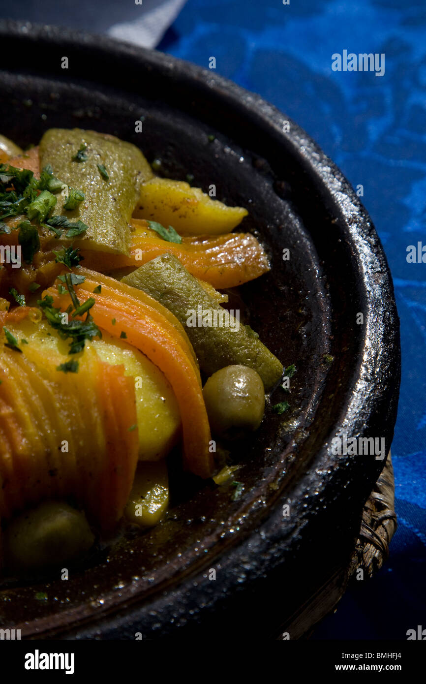 Tajine, or tagine, a type of cookware and traditional dish, that is common with Moroccan cuisine, as seen here in Marrakech. Stock Photo