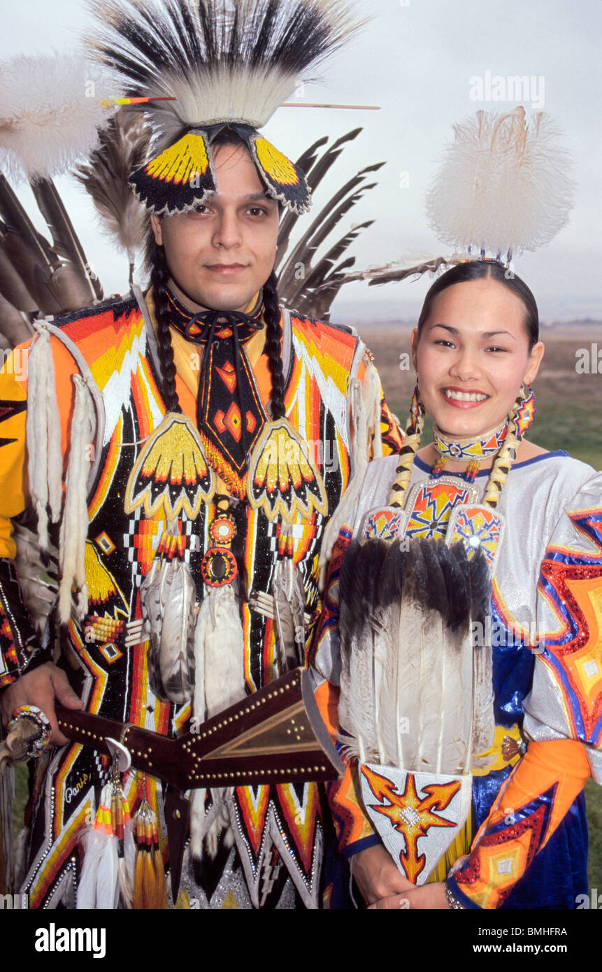 A handsome Native American Indian couple shows off their colorful tribal dress on the Umatilla Indian Reservation in Oregon, USA Stock Photo
