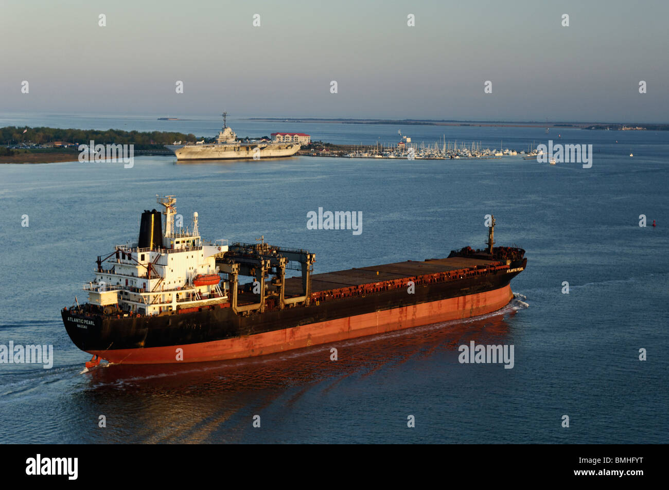 Tanker Ship Passing the USS Yorktown with Fort Sumter in the Distance near Charleston, South Carolina Stock Photo