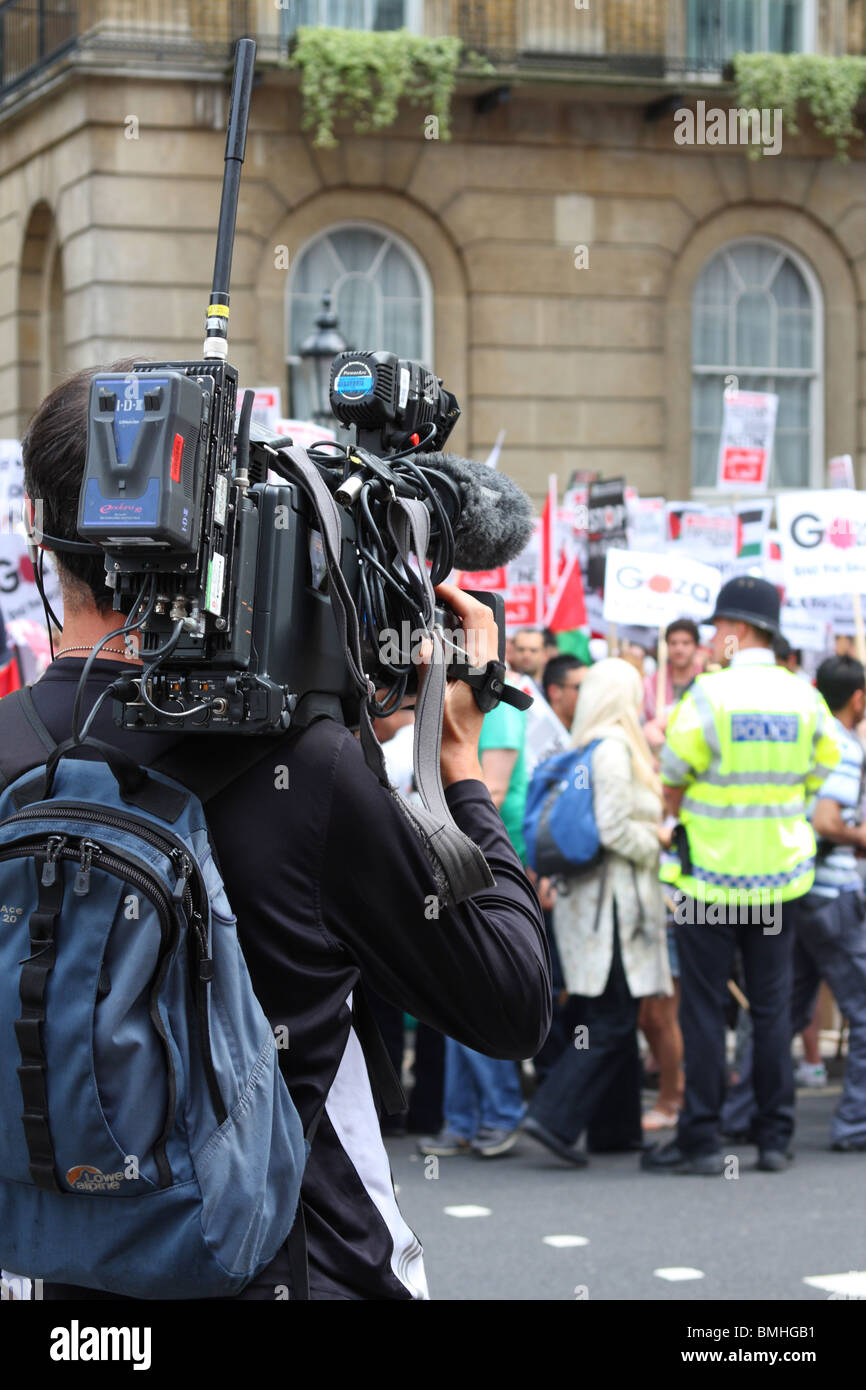 A TV News Cameraman at the 'Freedom for Palestine' demonstration on Whitehall, Westminster, London, England, U.K. Stock Photo