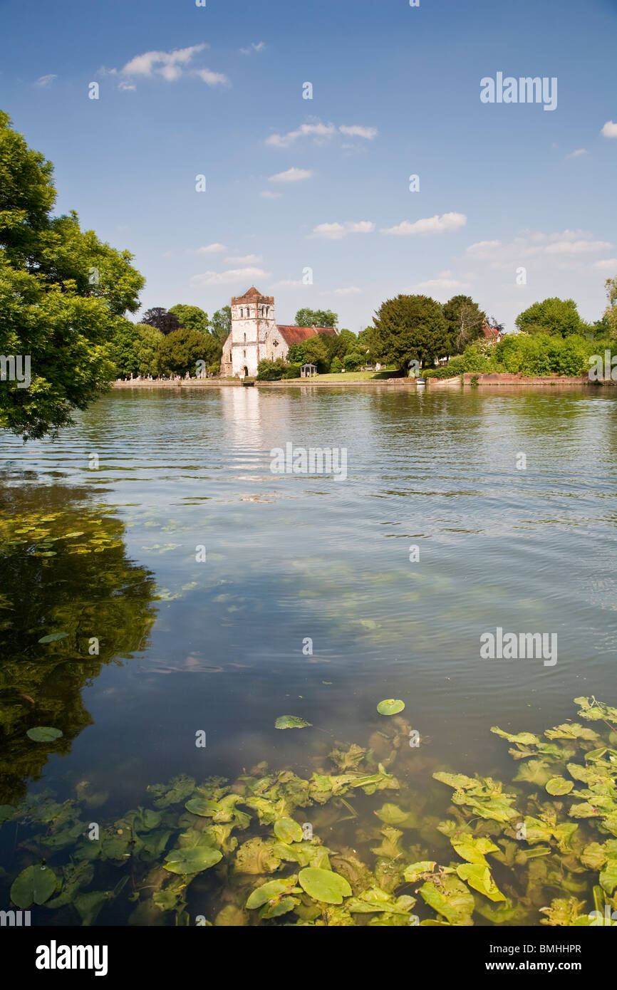 Bisham Church with River Thames near Marlow with water lilies and other aquatic plants Stock