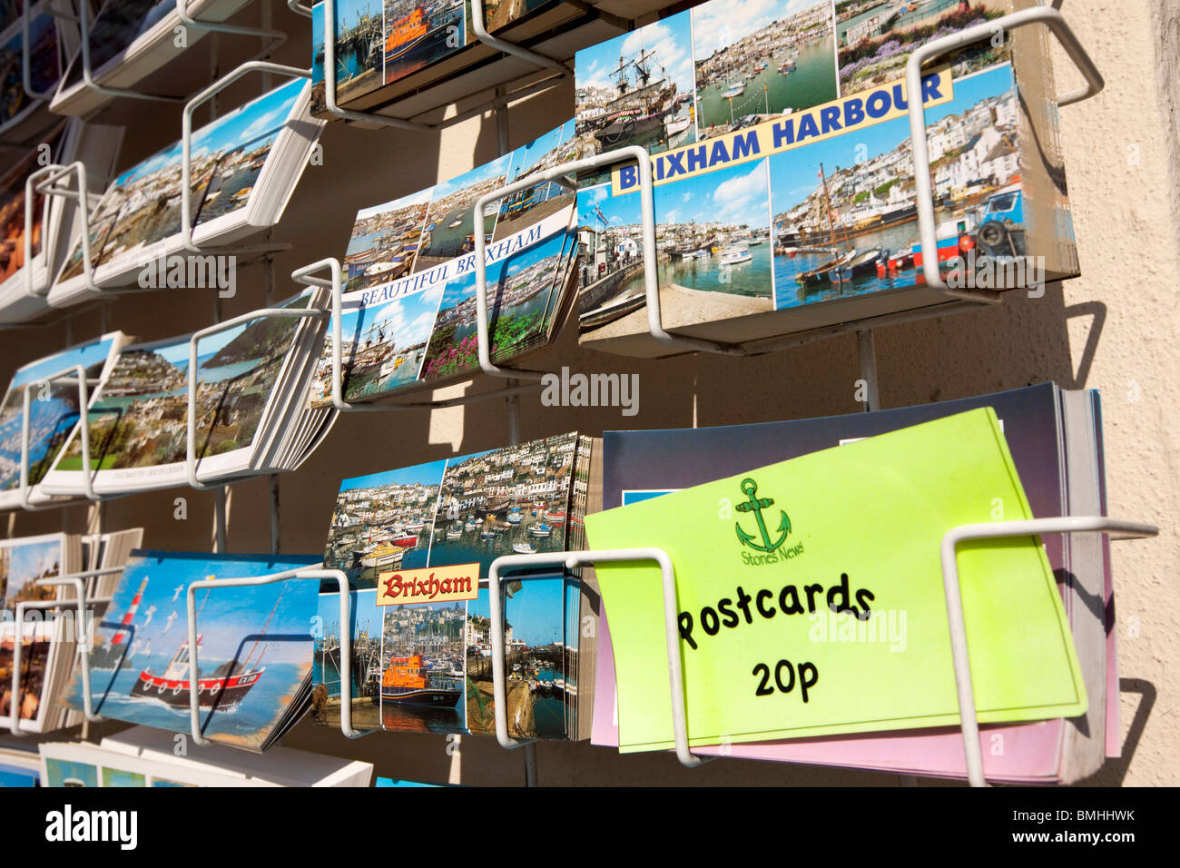 UK, England, Devon, Brixham colourful poicture postcards of local views in rack for sale Stock Photo