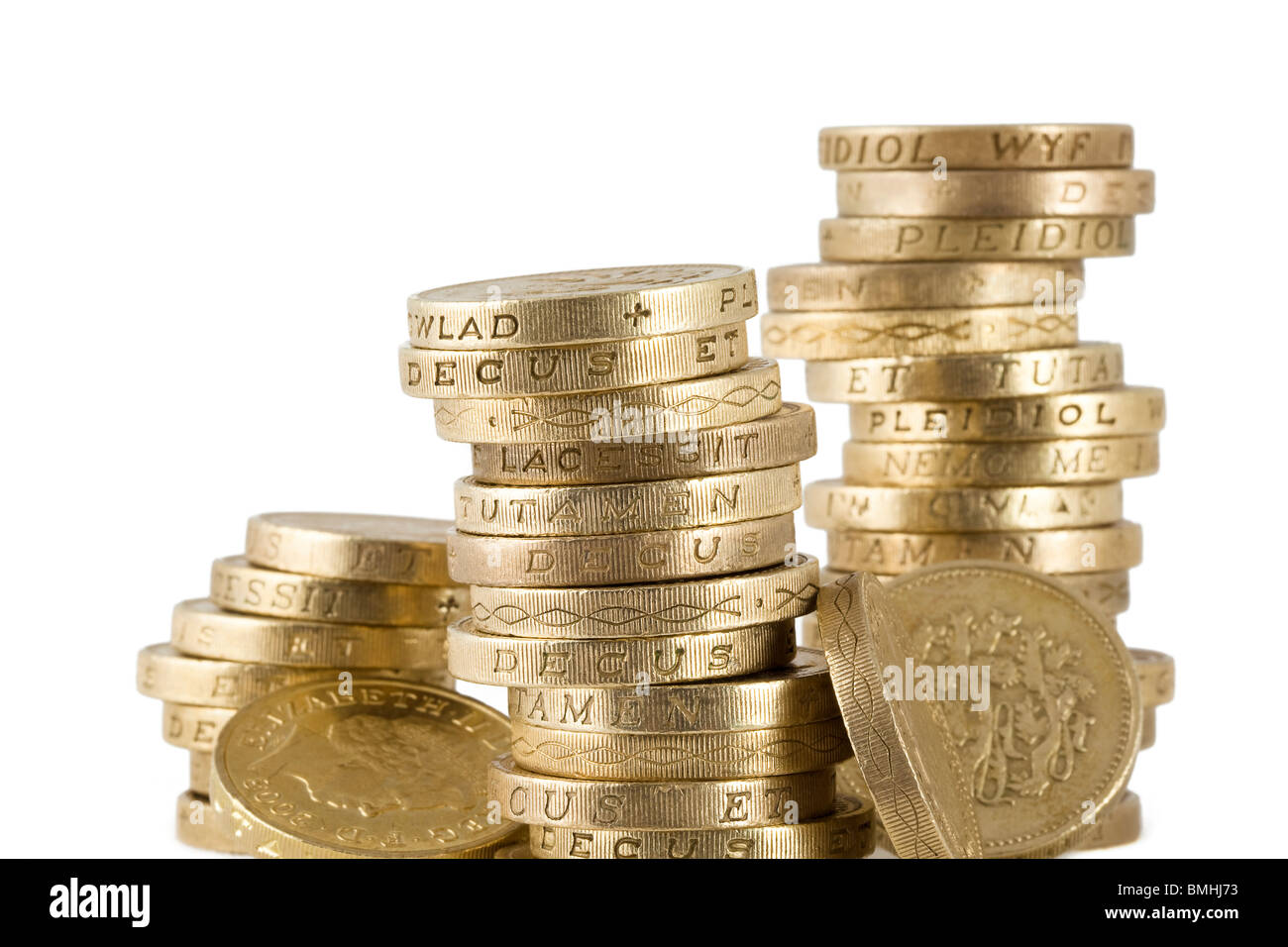 Wobbly piles of uk sterling pound coins Stock Photo