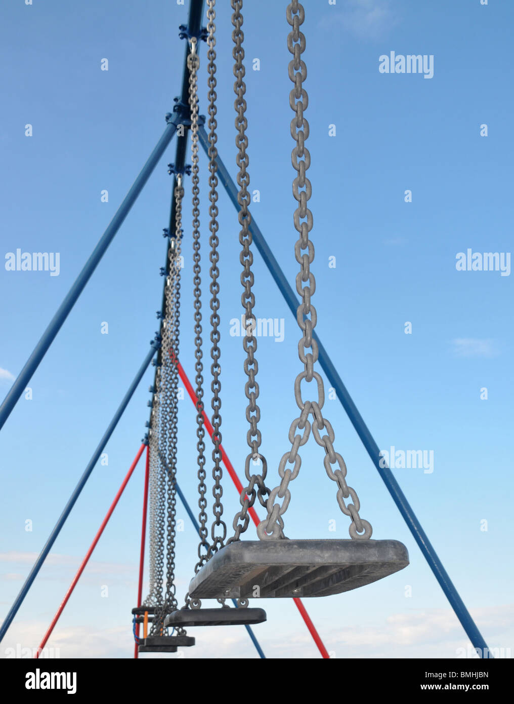 Looking up to swings and their frames. Stock Photo