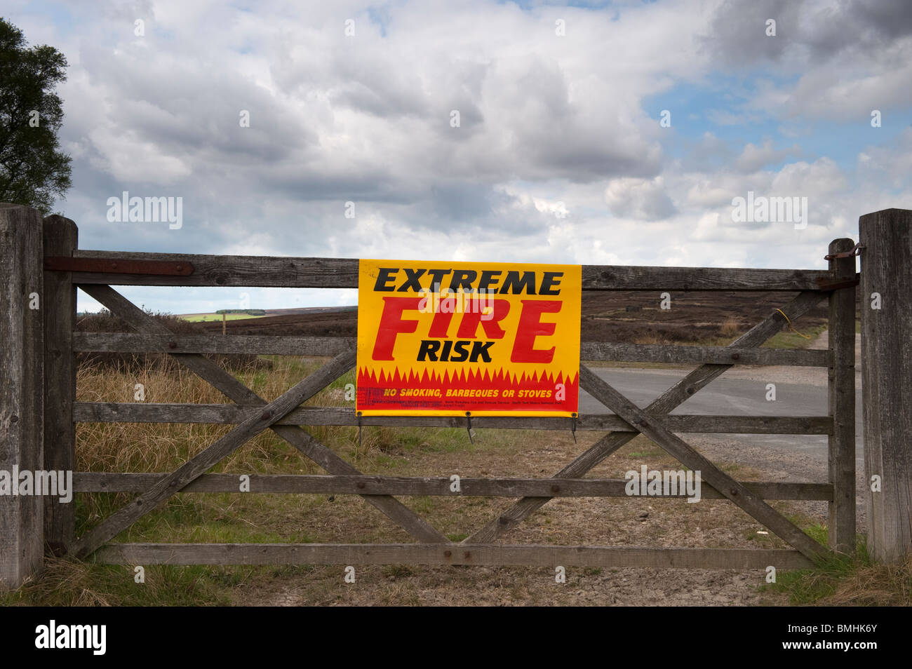 Fire hazard warning sign on gate near dry moor Stock Photo Alamy