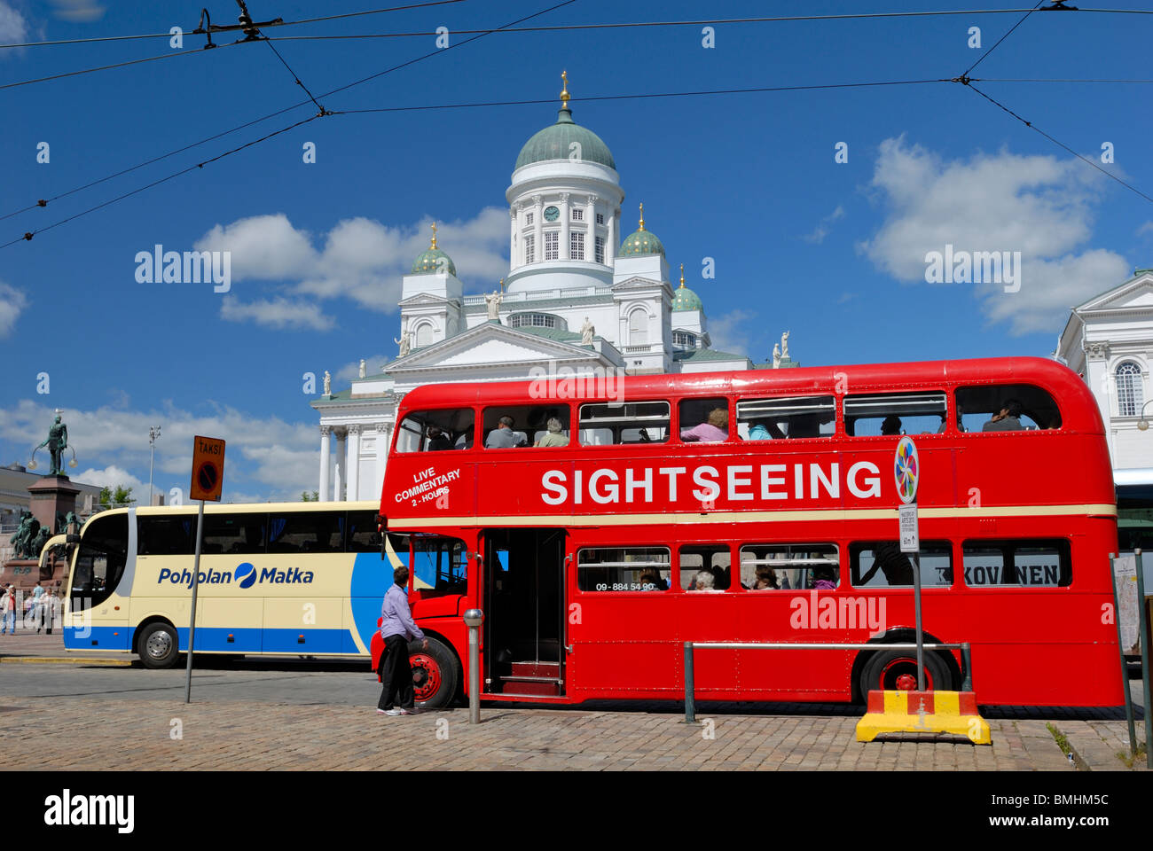 The traditional red double decker sightseeing bus at the Senate square's bus stop. Senate square, Helsinki, Finland, Scandinavia Stock Photo