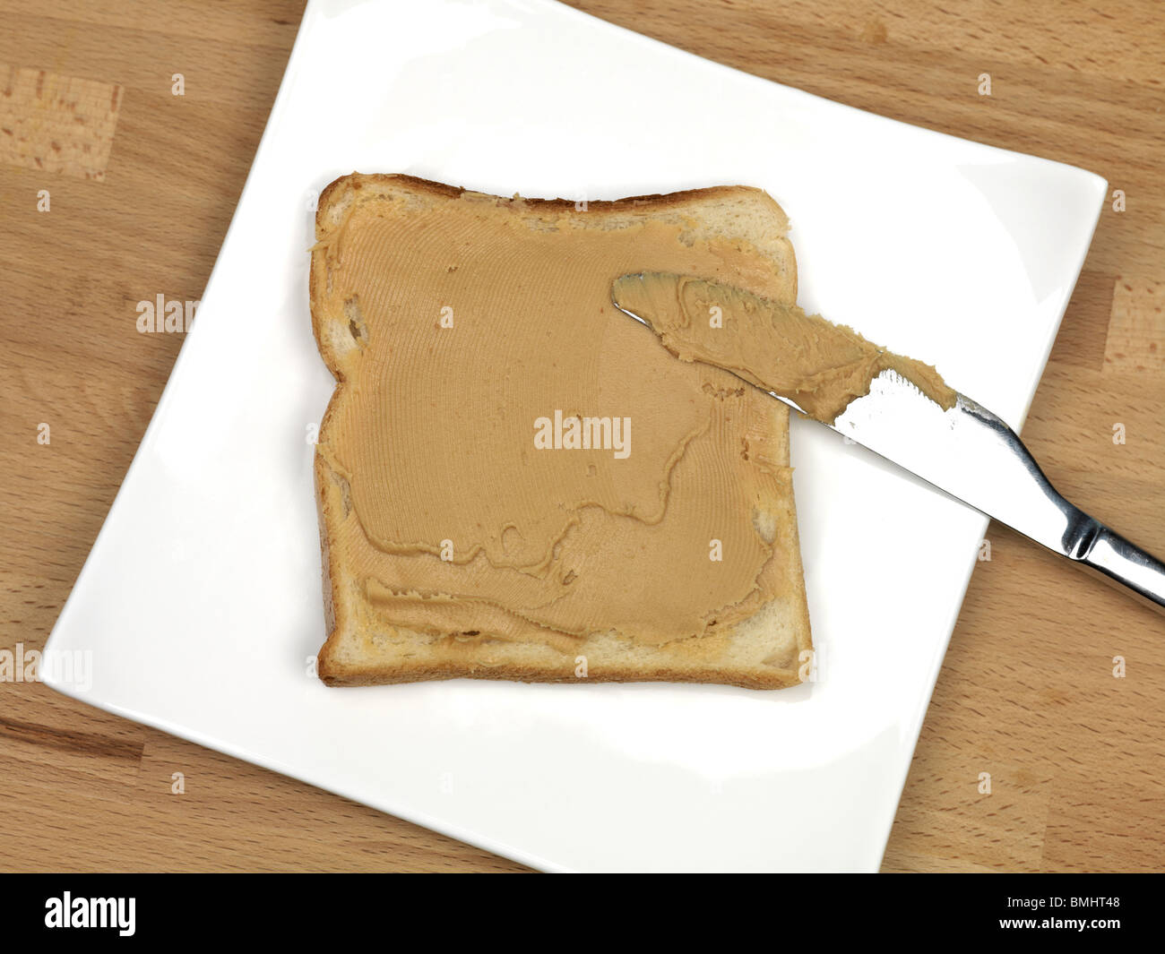 Peanut butter spread on white bread Stock Photo Alamy