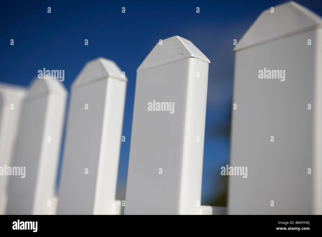 A close up of a white picket fence in Hope Town in the Abacos, Bahamas. Stock Photo