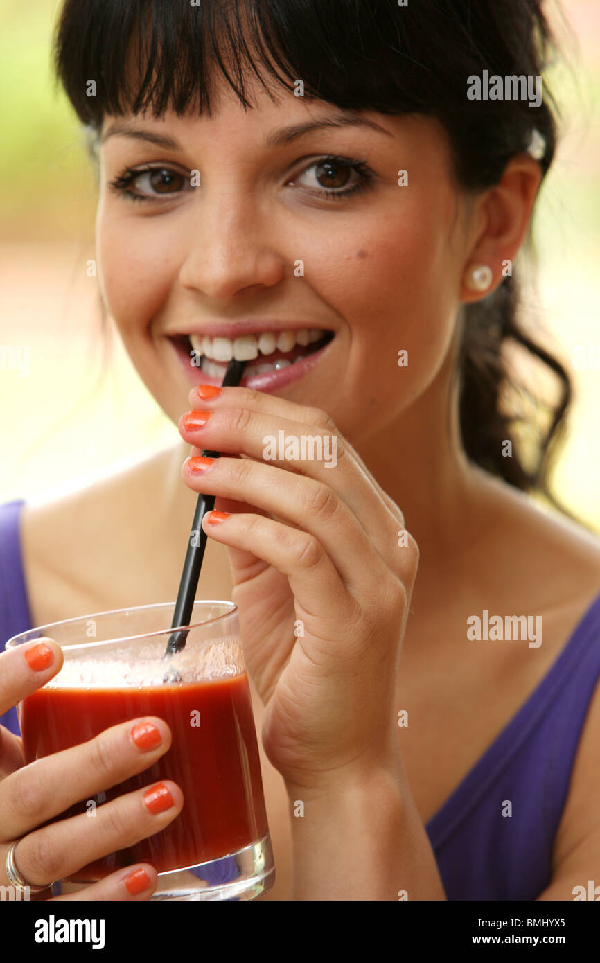 Young Woman Drinking Tomato Juice. Model Released Stock Photo Alamy