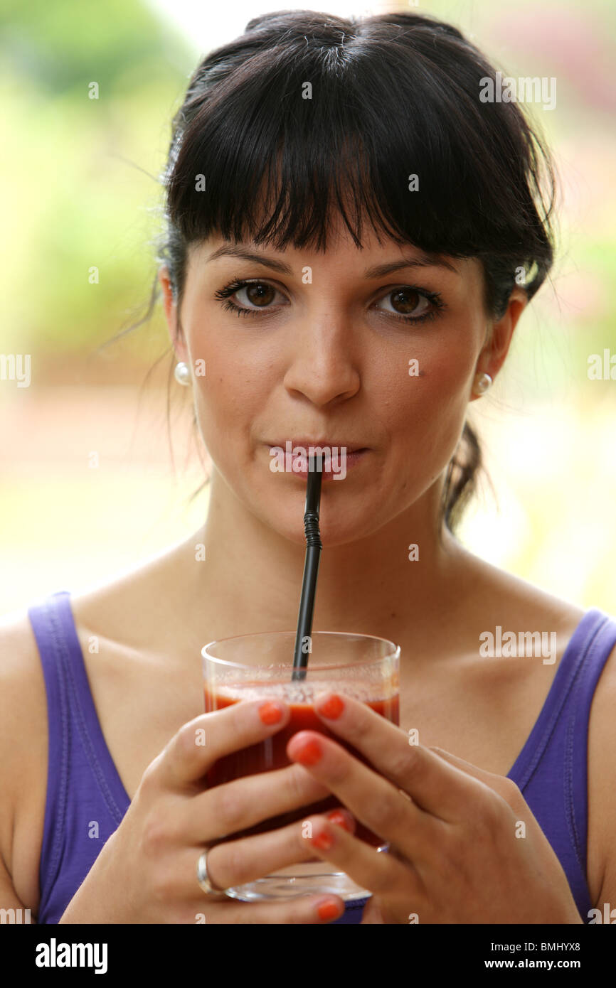 Young Woman Drinking Tomato Juice. Model Released Stock Photo Alamy