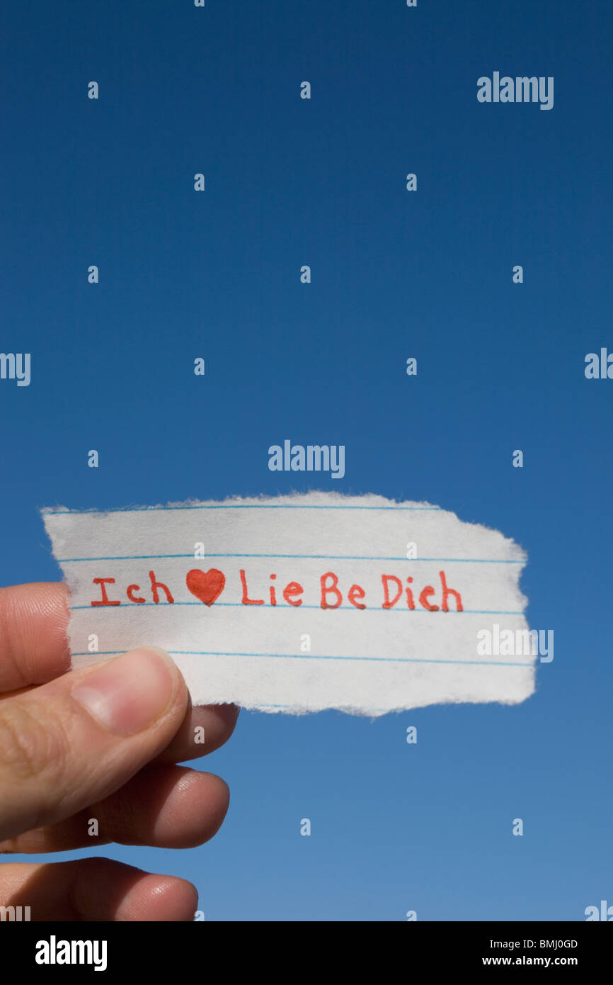 Hand holding German I love you note Stock Photo Alamy