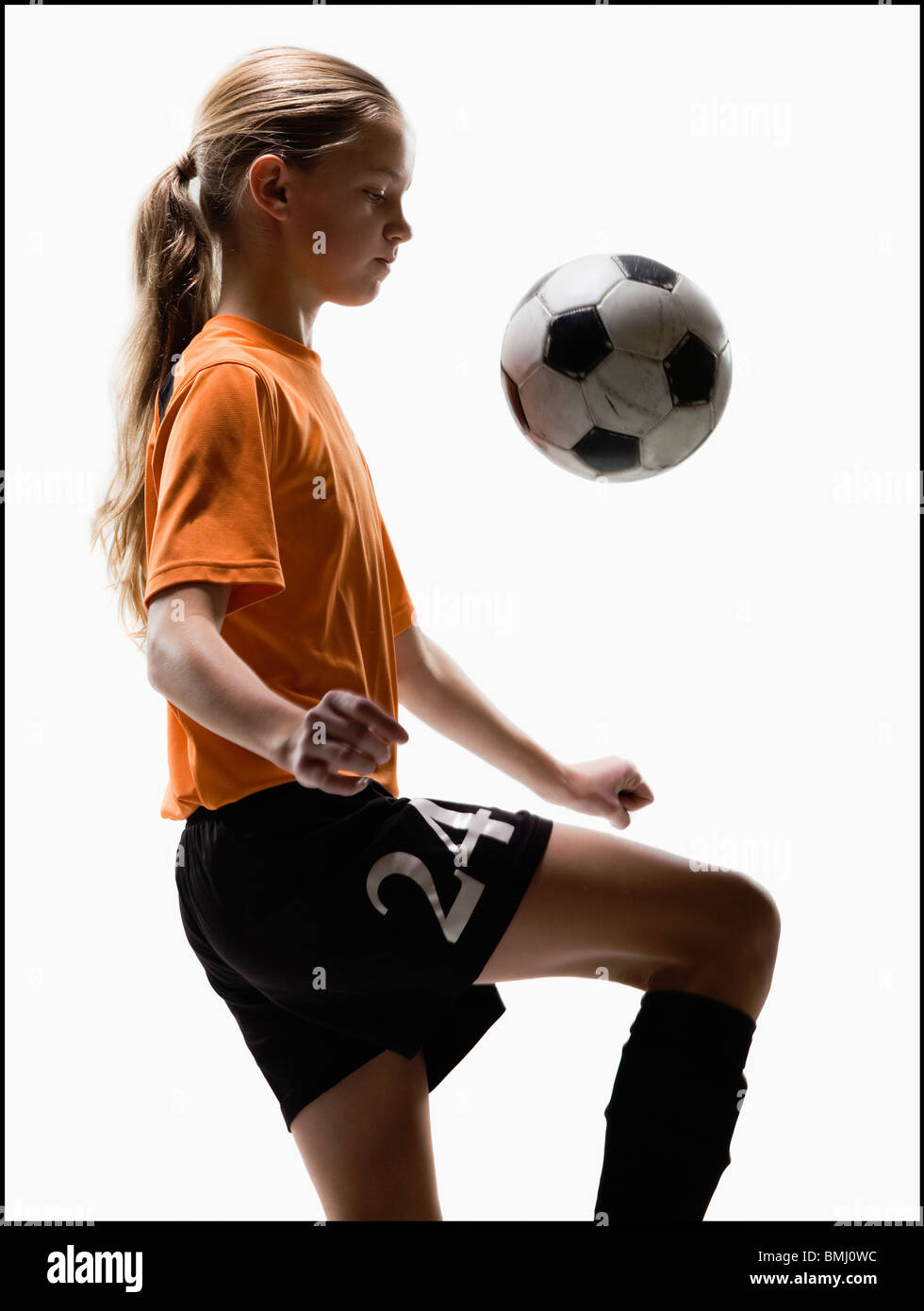 Girl dribbling soccer ball hires stock photography and images Alamy