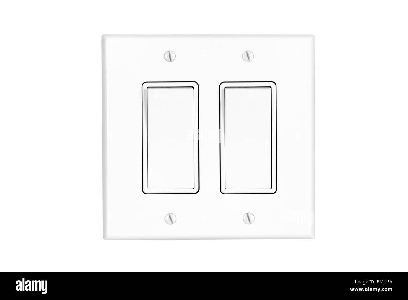 A modern white dual toggle electrical light switch isolated on white. Stock Photo