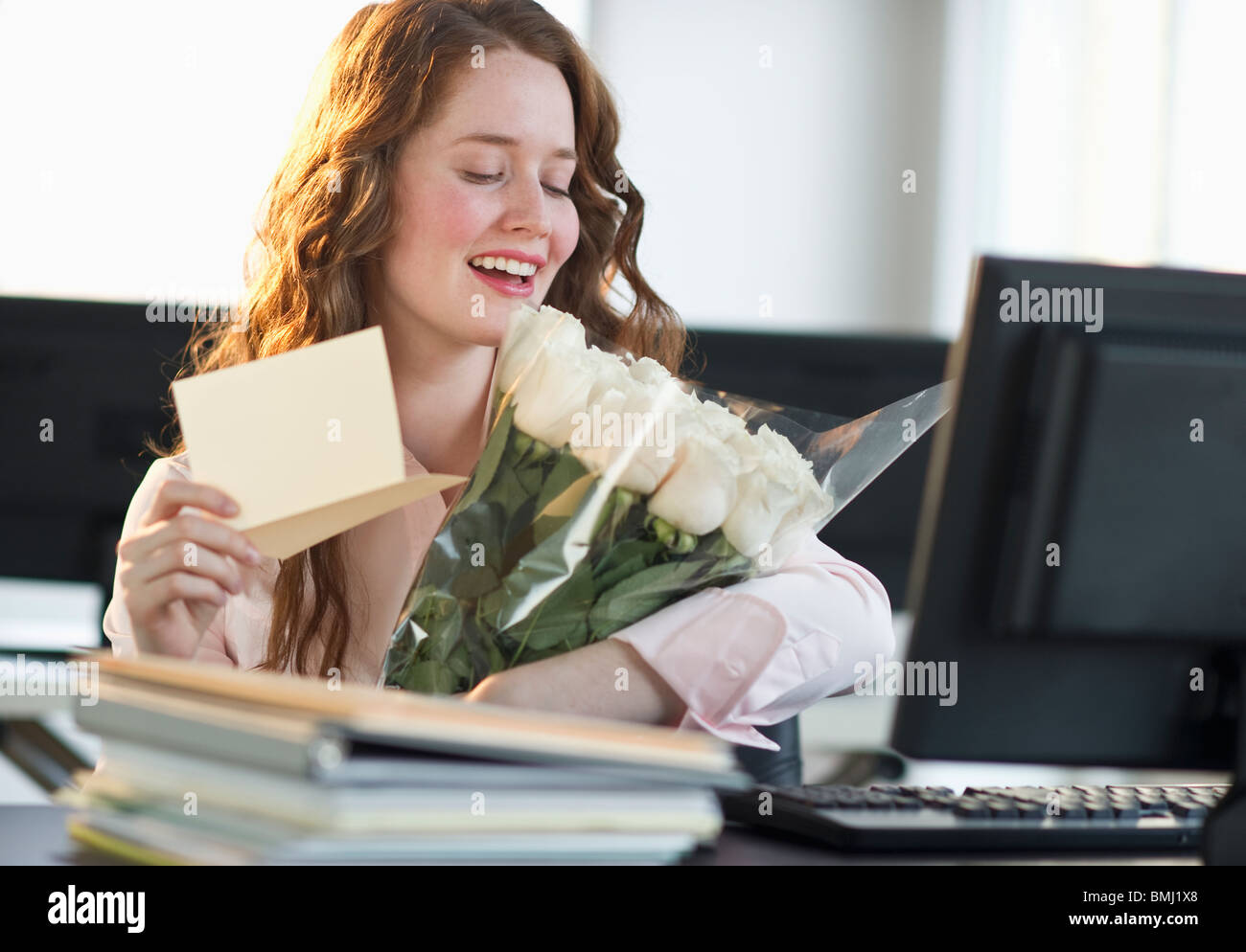 Woman holding bouquet of flowers Stock Photo - Alamy
