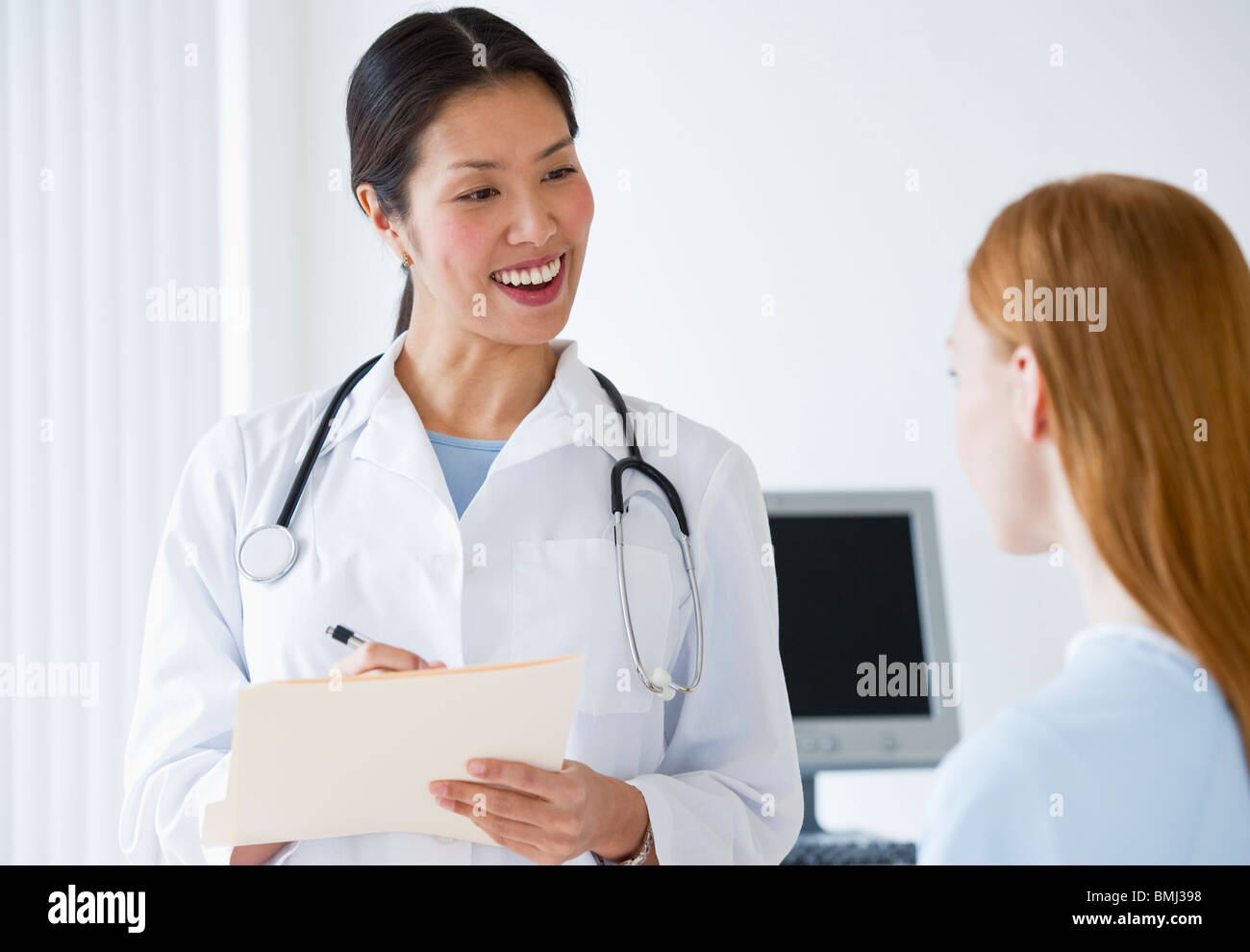 Doctor talking to patient Stock Photo