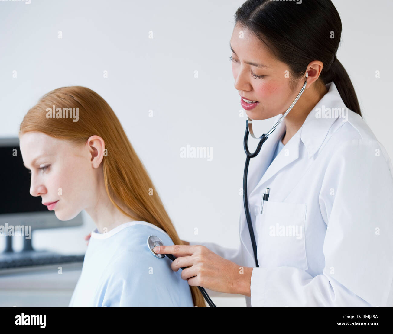 Doctor and patient at checkup Stock Photo