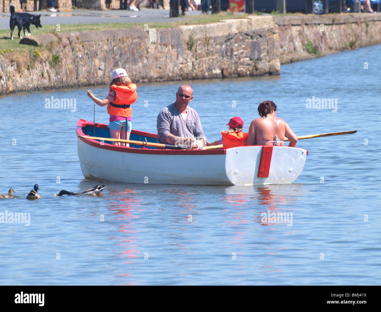 Family having fun boating, Bude, Cornwall Stock Photo