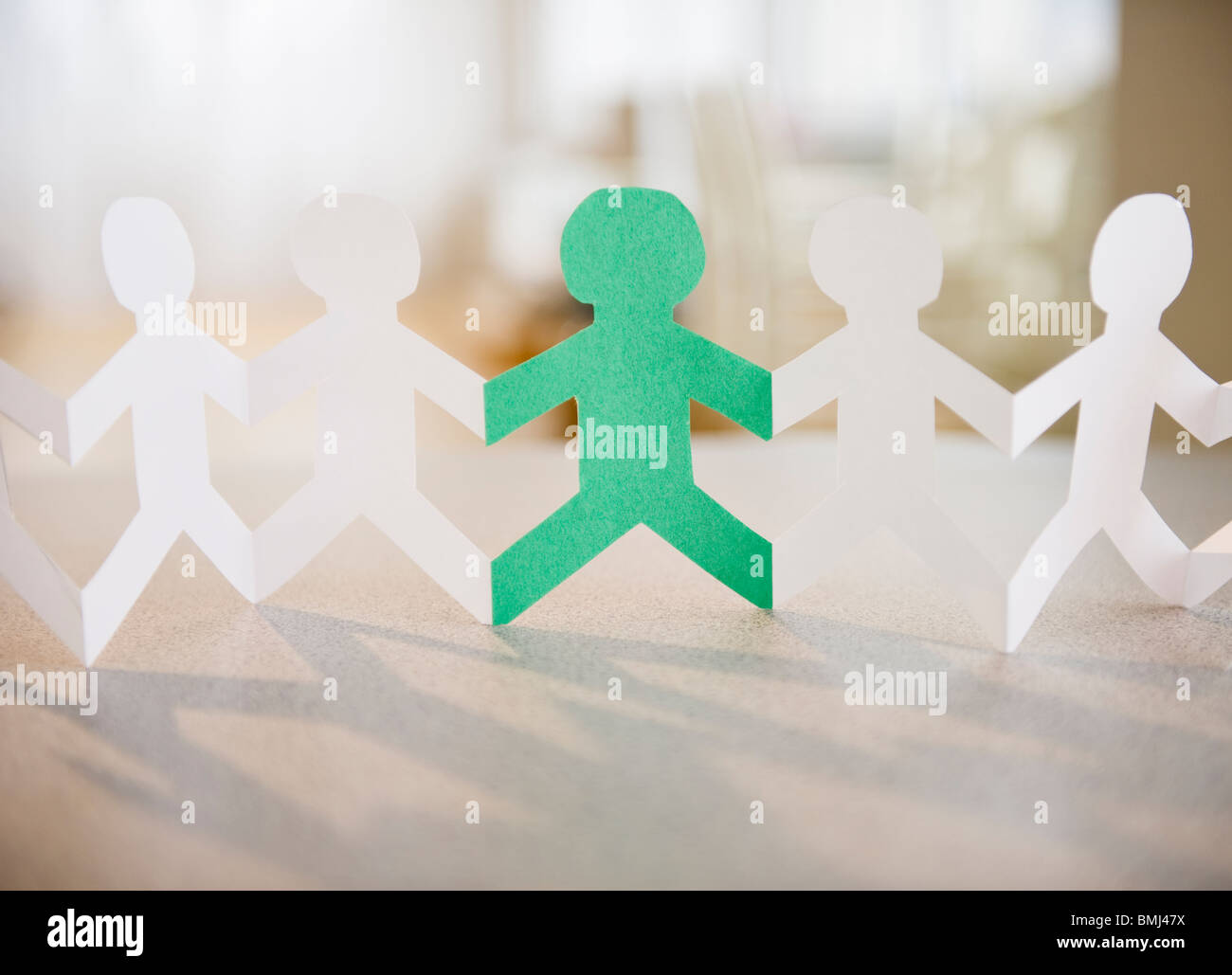 Paper dolls holding hands hires stock photography and images Alamy