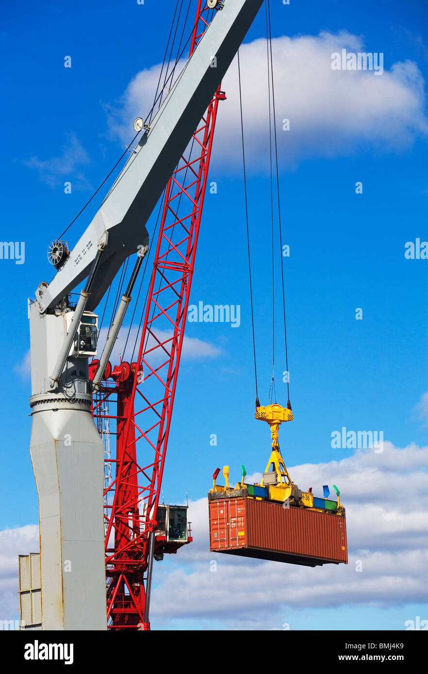Crane lifting shipping container Stock Photo