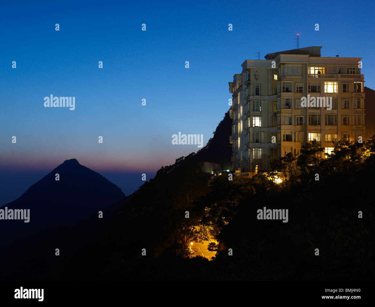 An apartment building situated on top of the mountain in Hong Kong peninsula, a prime property spot for the rich and famous. Stock Photo