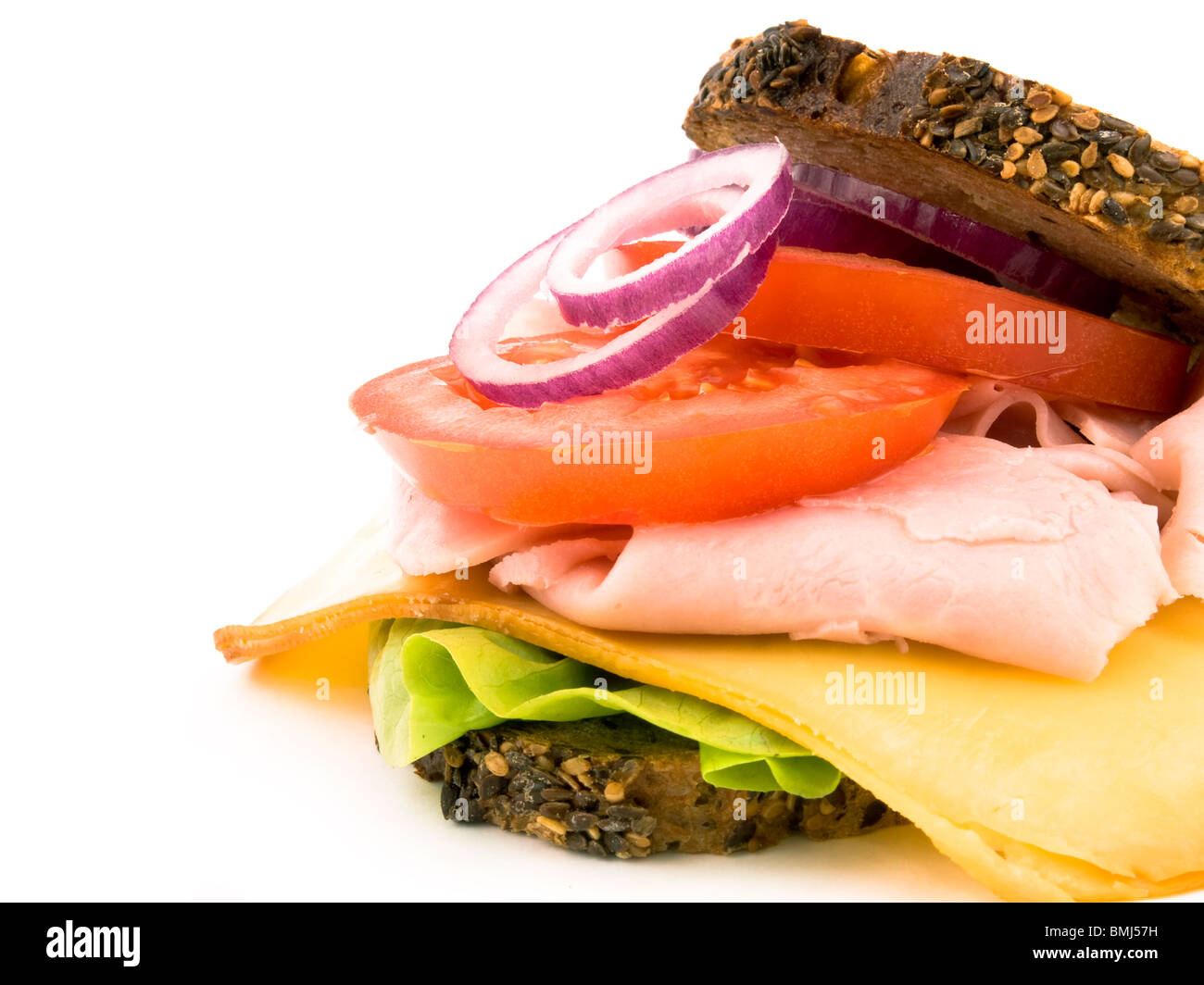 Granary bread with lettuce, smoked cheese, crumbled ham, sliced tomato