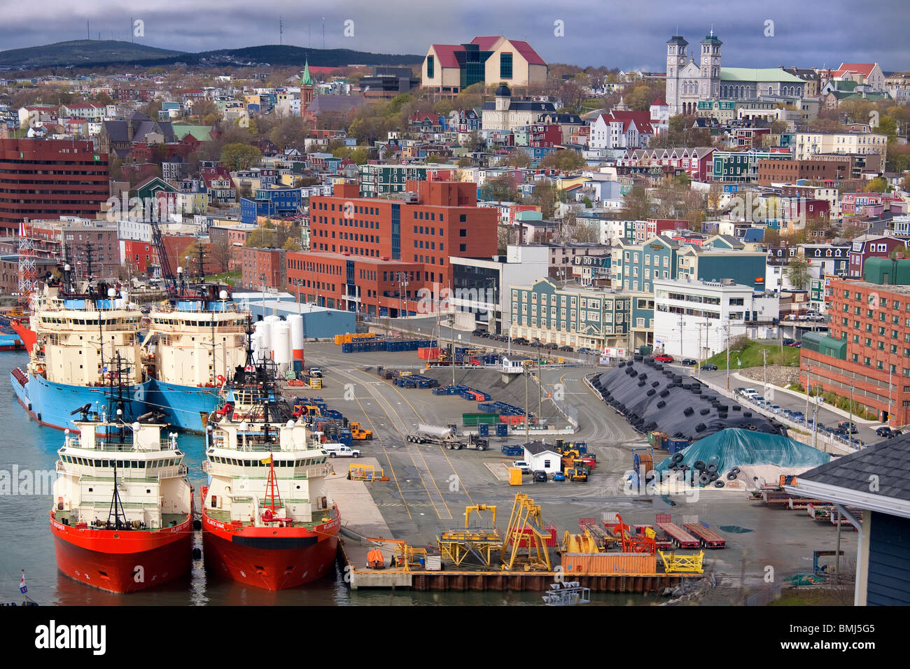 Ships along the waterfront of the city of St. John's, Newfoundland.  St. John's is the capital of Newfoundland and Labrador. Stock Photo