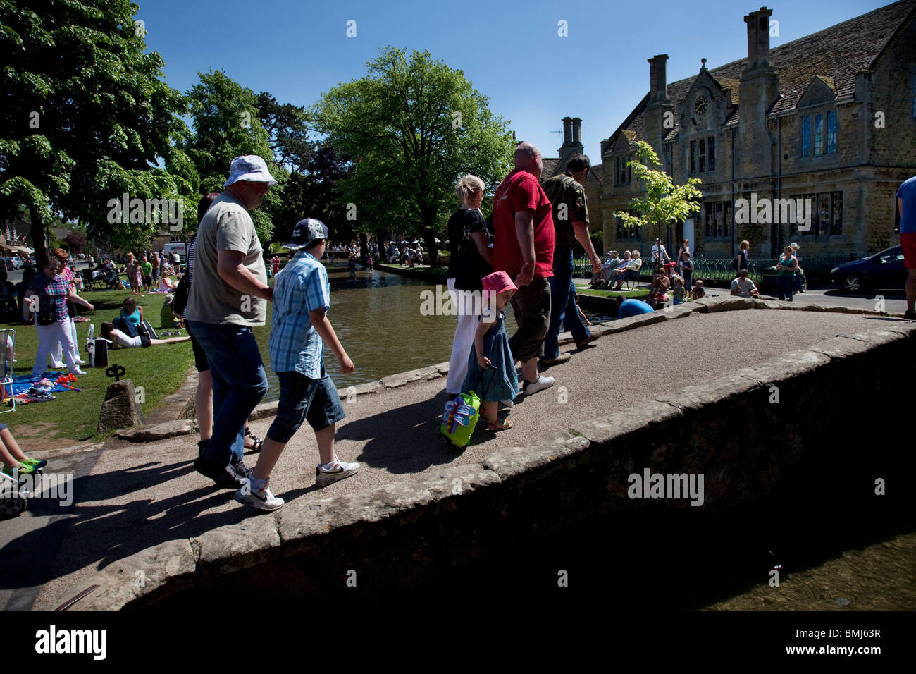 Crowds of visitors at Bourton-on-the-Water in The Cotswolds, Gloucestershire, UK. Stock Photo