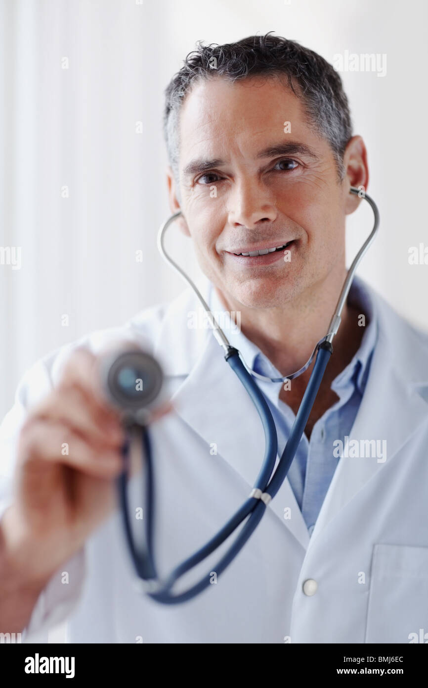 Doctor holding stethoscope Stock Photo Alamy