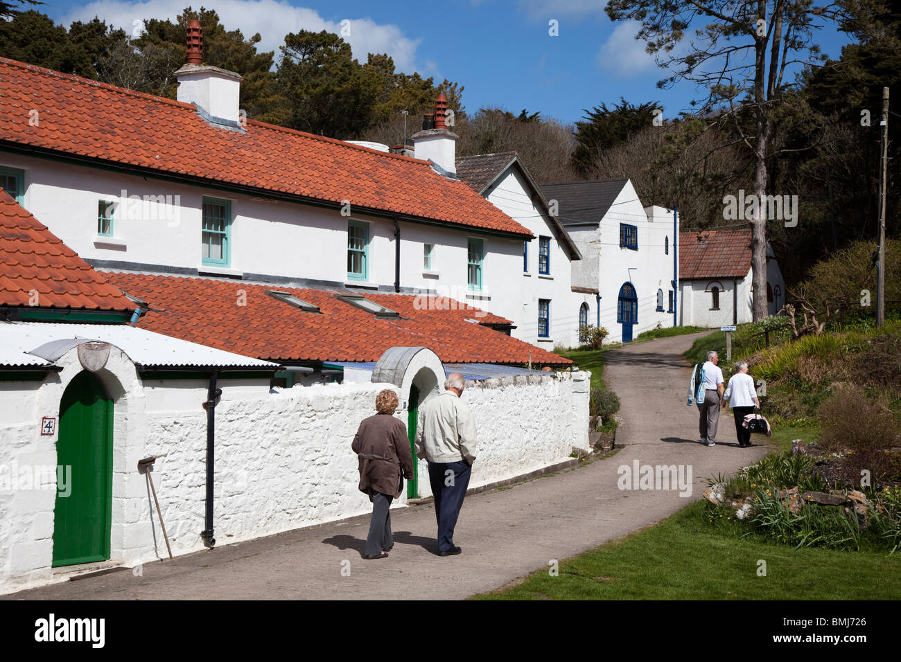 Visitors walking through the monastery village Caldey Island Wales UK