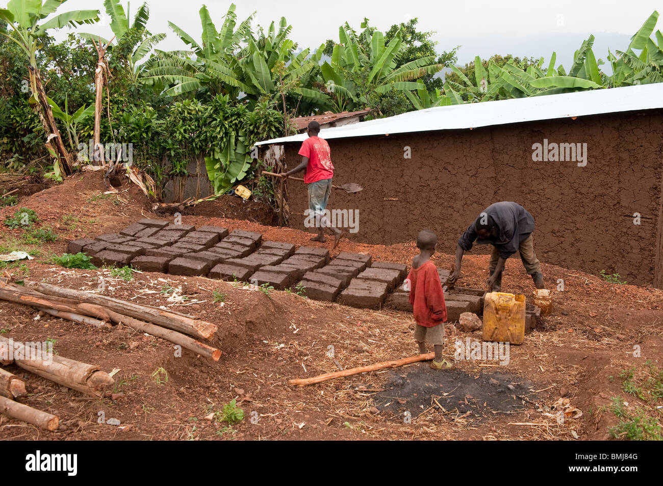 Making bricks from mud for a new house. Rwanda Stock Photo