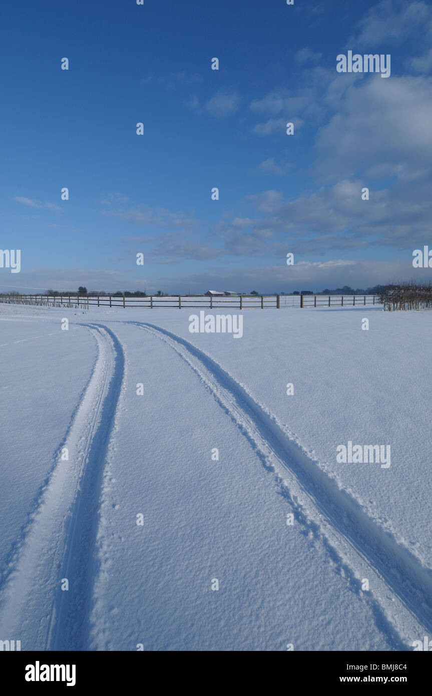Tyre tracks in snow Stock Photo - Alamy
