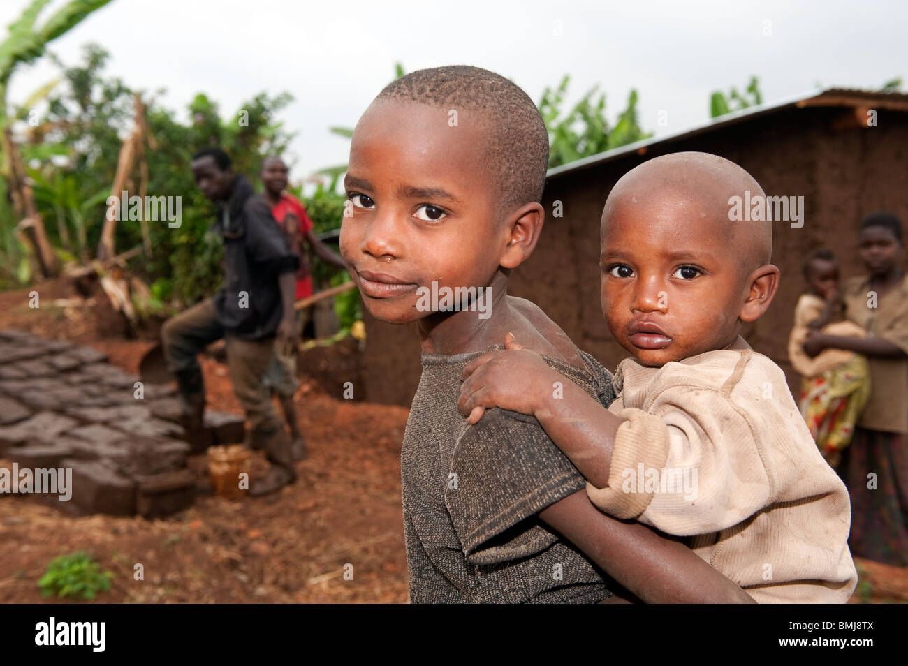 Siblings Rwanda Two Rwandan brothers, eldest carrying the youngest on his back. Rwanda ...