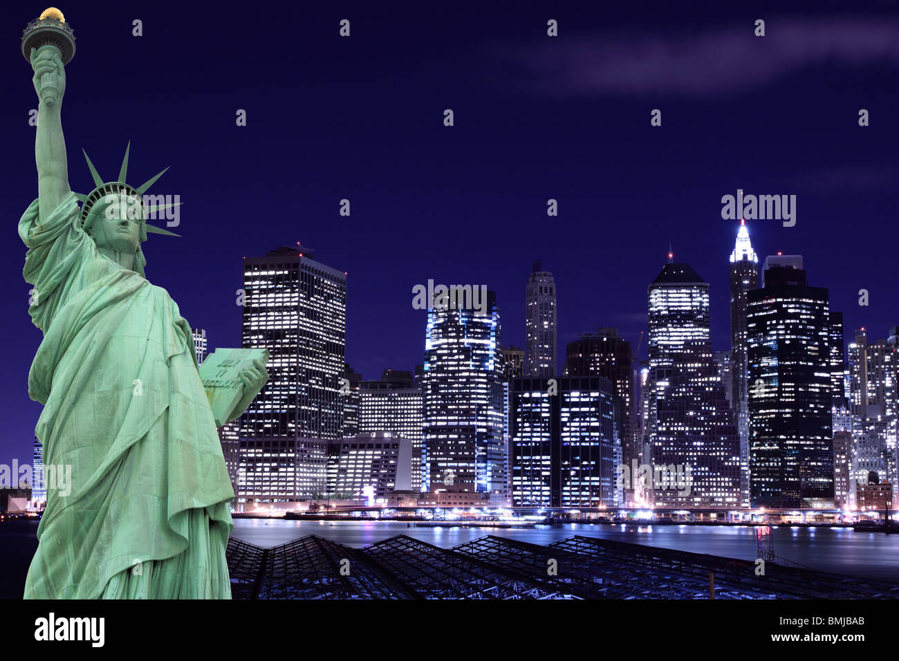 The Statue of Liberty and Manhattan skyline at Night, New York City