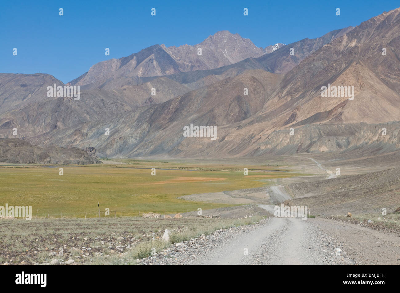 Road running through Madyian Valley, Pamirs, Tajikistan Stock Photo