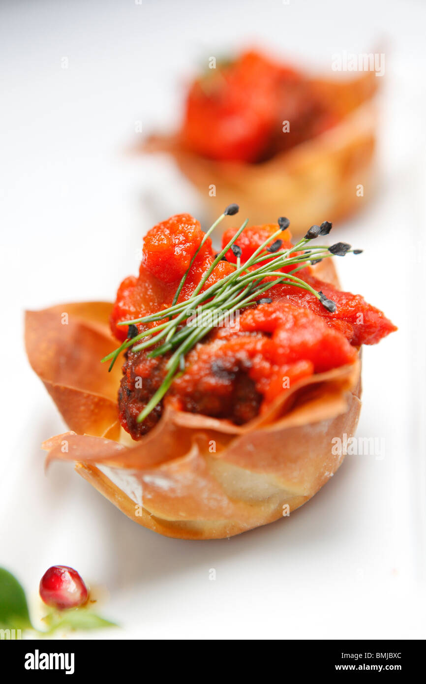 Tomato and pastry mezze food served in a restaurant Stock Photo